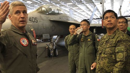 Rear Admiral Steve Koehler, commander CSG-9 of the U.S. aircraft carrier Theodore Roosevelt, briefs top Philippine generals.