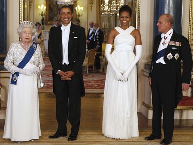 President Barack Obama, first lady Michelle Obama, Queen Elizabeth II, and Prince Philip pose for photographers prior to a dinner hosted by the queen at Buckingham Palace