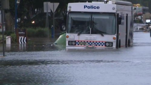 A police van trapped by floodwaters in Lismore. An evacuation order has been issued for the CBD with BoM warning the Wilsons River will likely breach the levee. 
