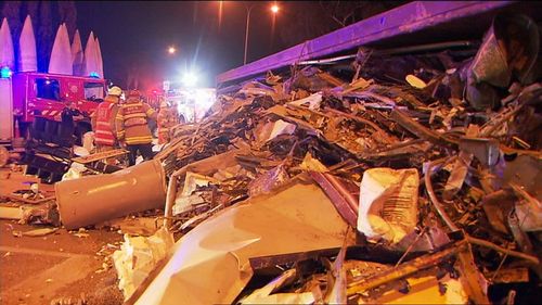Crews spent much of last night clearing the wreckage. A large amount of scrap metal and old steel was in the truck's load. Picture: 9NEWS