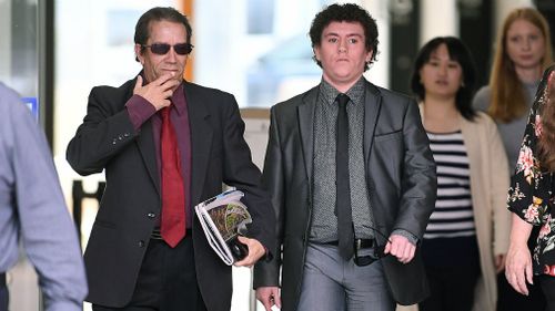 Caleb Wills (right) outside court.