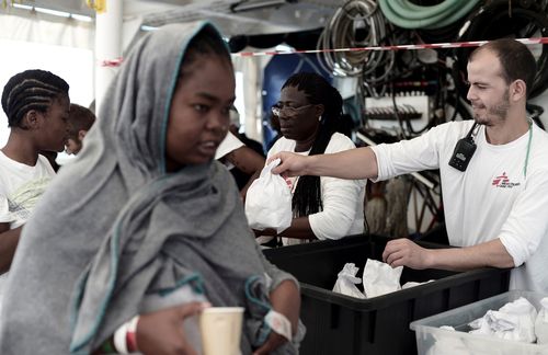 The migrants were treated by volunteer doctors before disembarking the ships. Picture: AP