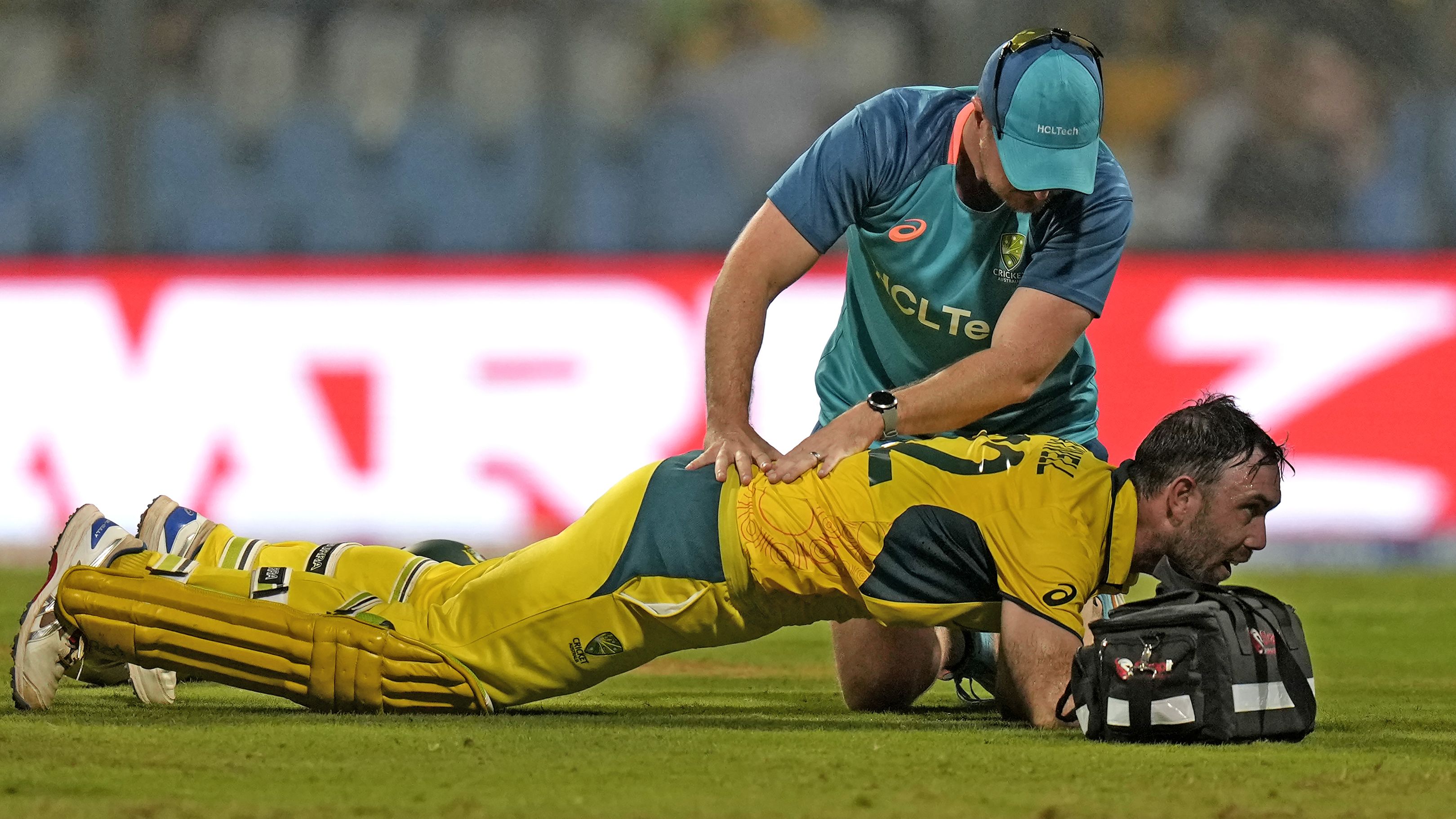 Australia&#x27;s Glenn Maxwell is attended to during his record innings.