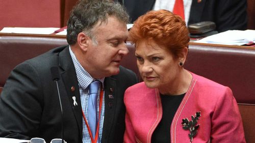 Rod Culleton speaks to Pauline Hanson in parliament last month. (AAP)