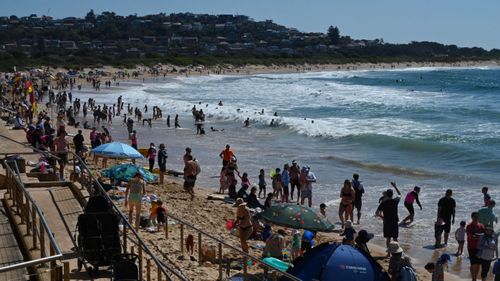 Authorities have reminded people to maintain social distancing while enjoying the long weekend. Pictured is Dee Why Beach.