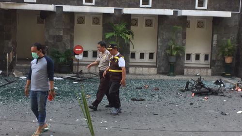 Television images from the attack sites show debris scattered around the entrance of one church. Picture: AAP.