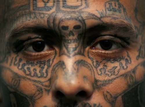 Wilmer Matamoros, 23, an active Mara Salvatrucha gang leader, poses inside his cell at Tamara Prison, 29 kilometers, 20 miles, north of Tegucigalpa, Honduras, Feb. 21, 2006. Matamoros admits that he will never retire from the gang. For him the gang is his life, and a member should only leave by death.