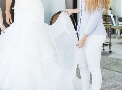 Trying on wedding dress