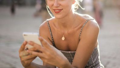 Pexels stock image of a woman on her phone.