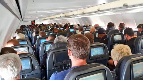 This photo purportedly showed a busy plane flying to Brisbane on April 13. Qantas has said middle seat booking is no longer available.
