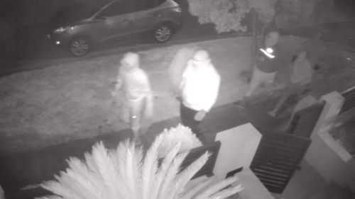 A man has been viciously beaten by a group of masked and armed attackers in front of two teenage girls during a home invasion in Western Sydney. ï»¿