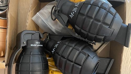 Fake grenades found at the address of a man allegedly impersonating an AFP officer.