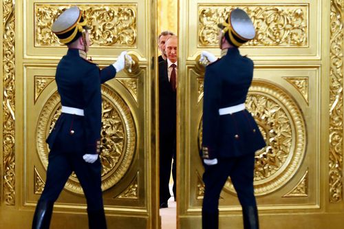 Honour guards open the doors for Russian President Vladimir Putin 