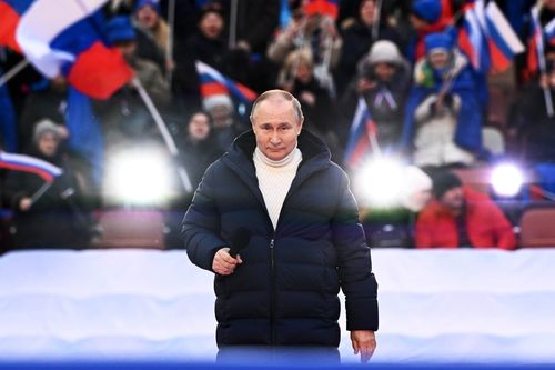 Russian President Vladimir Putin delivers his speech at the concert marking the eighth anniversary of the referendum on the state status of Crimea and Sevastopol and its reunification with Russia, in Moscow, Russia, Friday, March 18, 2022.