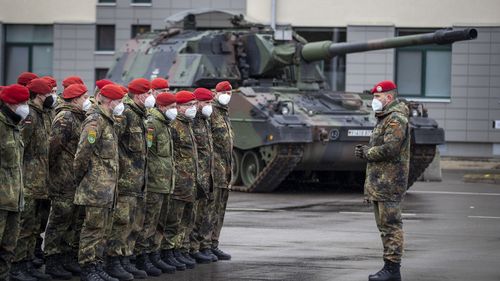 German Bundeswehr soldiers of the NATO enhanced forward presence battalion waits to greet German Defense Minister Christine Lambrecht upon her arrival at the Rukla military base 100 kms (62.12 miles) west of the capital Vilnius, Lithuania.