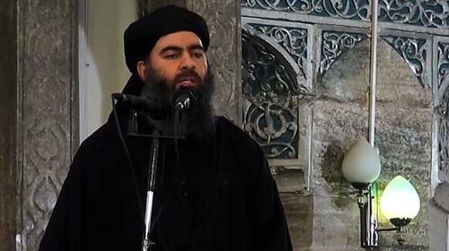 A still from a video released on July 5 by Al-Furqan Media shows alleged ISIL leader Abu Bakr al-Baghdadi preaching at an event. (Getty)