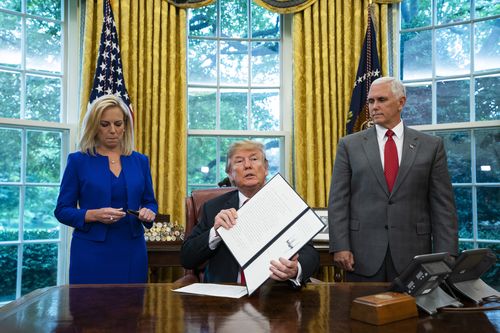 President Donald Trump signed the executive order to stop separating children from their families this morning. Picture: AAP