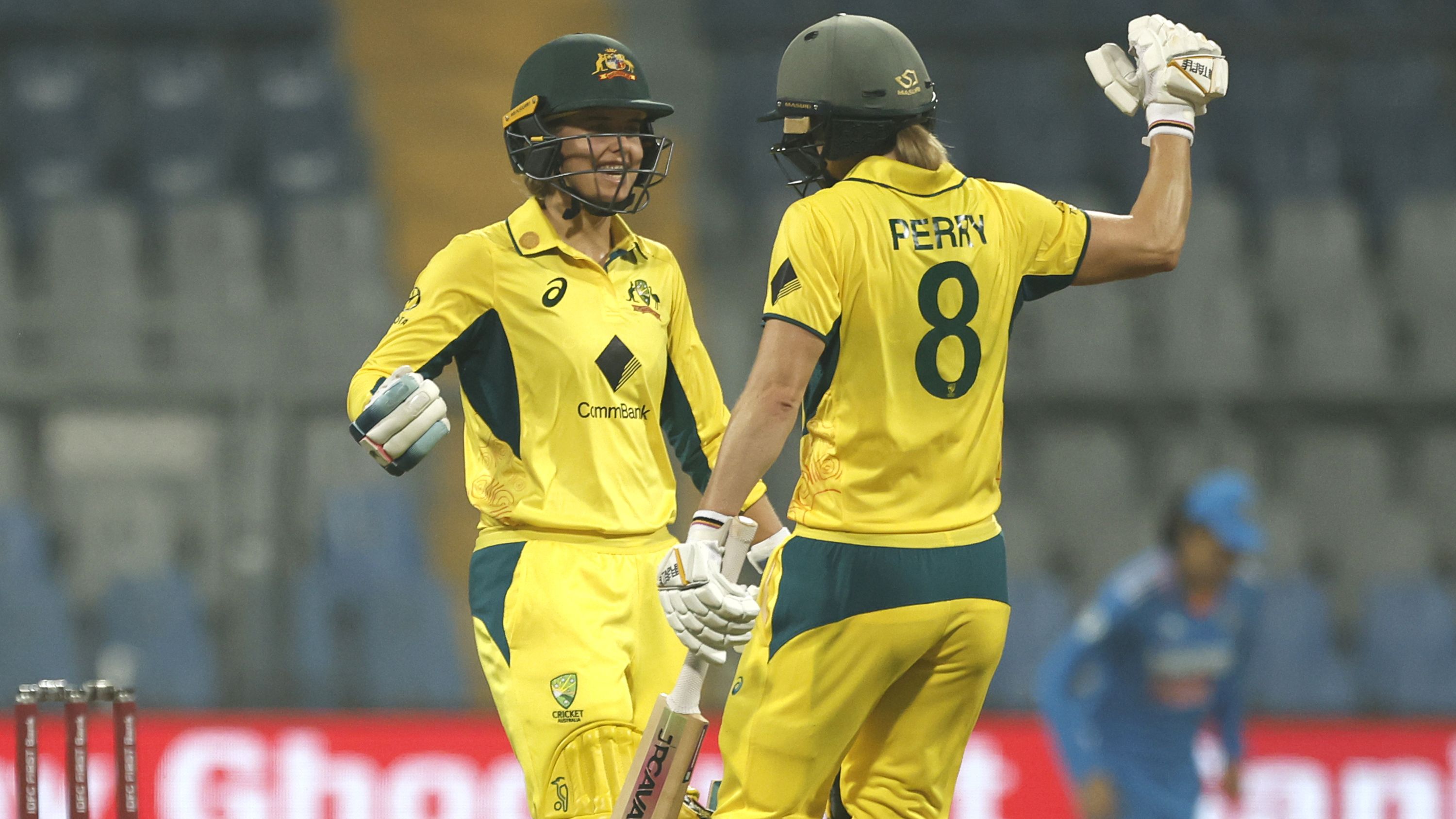 Phoebe Litchfield of Australia celebrates after scoring a 50 with Ellyse Perry.