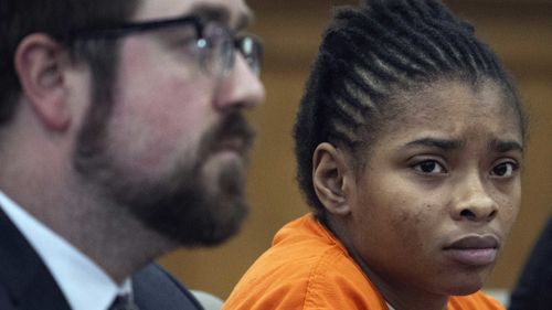 Chrystul Kizer,, listens as she sits with her attorney Gregory Holdahl during a hearing Thursday, May 9, 2024, at the Kenosha County Courthouse.