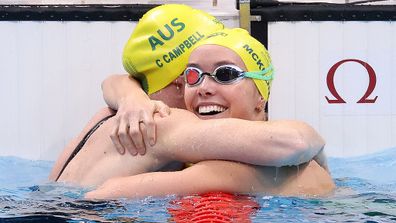 Australian swimmers hug following 100 metre Freestyle Final at Olympics.