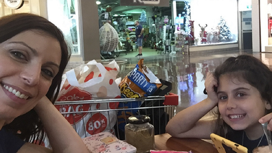 Jo Abi and her daughter grocery shopping