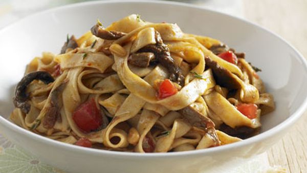 Tagliatelle with porcini, pine nuts, fresh tomato and thyme