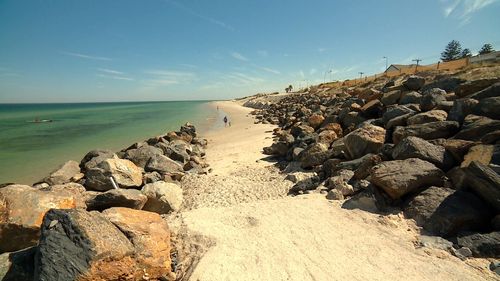 The barbs are believed to be old sand reinforcement materials that have become exposed from sand erosion.