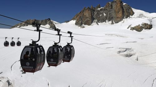 Fifty people to remain trapped in cable cars suspended over French Alps overnight