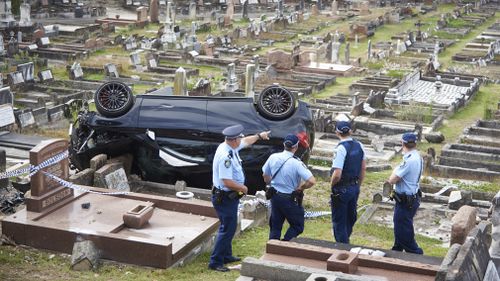 Police survey the crash scene today. (AAP)