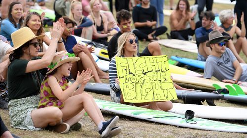 Protesters attend a rally at Bondi Beach against plans for Norwegian oil company Equinor to drill in the waters off the Great Australian Bight.