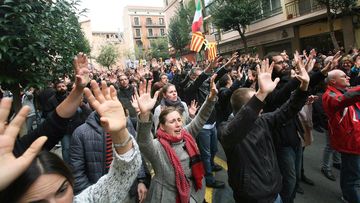 Hundreds of people take part at a demonstration to protest against the imprisonment of pro-independence leaders and demand their freedom in Tarragona, Catalonia. (AAP)