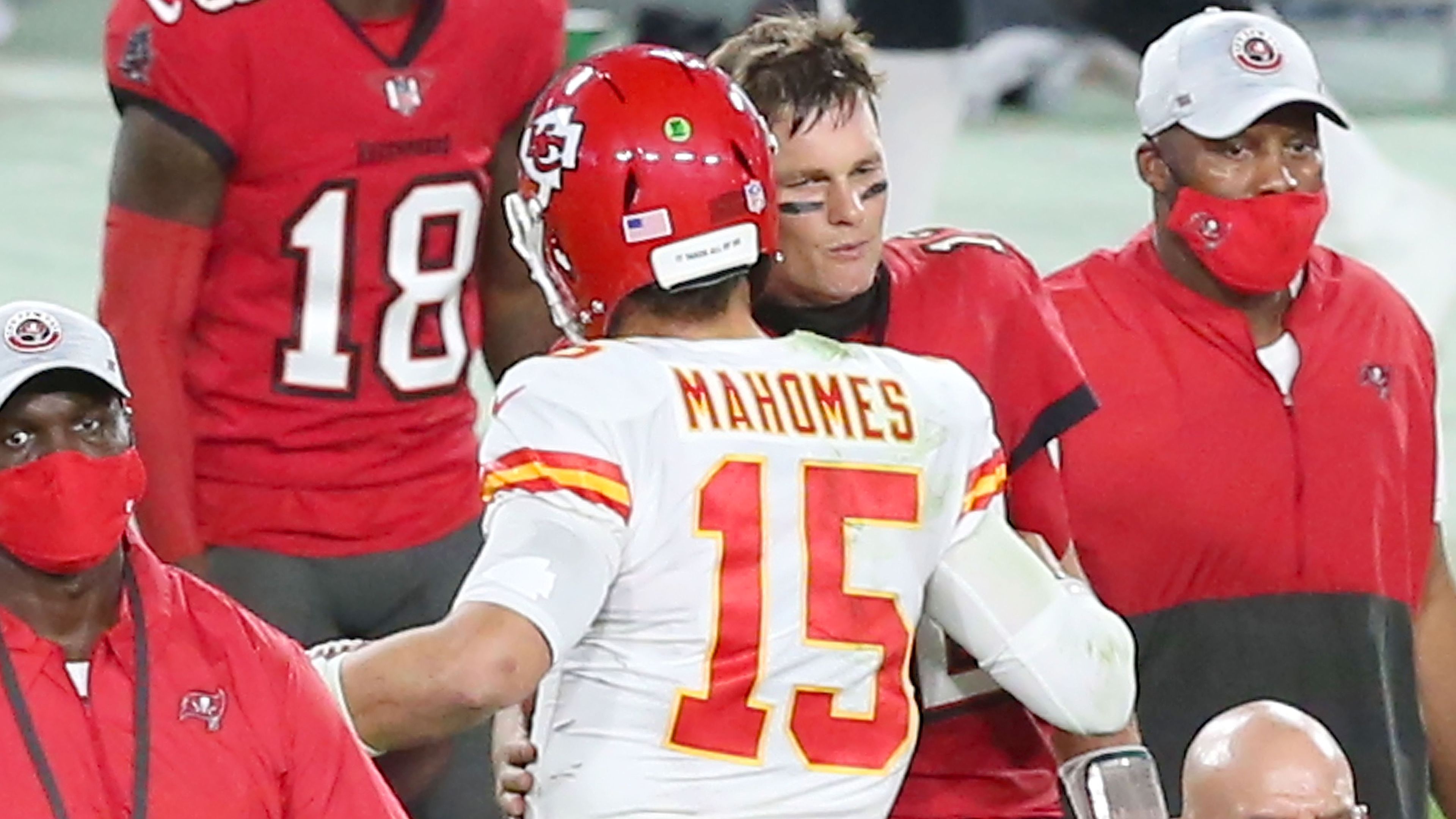 Tom Brady of the Buccaneers shakes hands with Patrick Mahomes of the Chiefs.