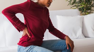 Young black woman suffer back pain cramp