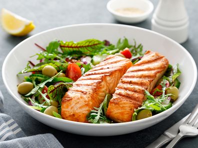 Grilled salmon fillet and fresh vegetable salad. 