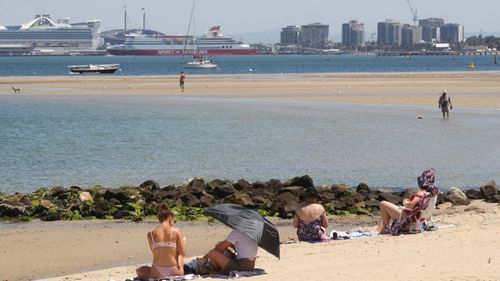 Beachgoers are seen at St Kilda beach in Melbourne, Thursday, January 30, 2020. The mercury is expected to reach 39C in Melbourne on Thursday before hitting a top of 43C on Friday afternoon