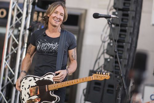 Australian country music star Keith Urban was helped out at the till of a store when he was short of a few dollars. Picture: AAP.