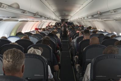 Passengers on a full plane 