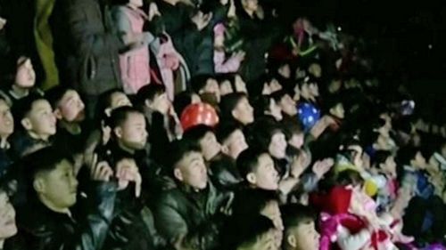 A rapt crowd watches New Year's Eve fireworks in North Korea.