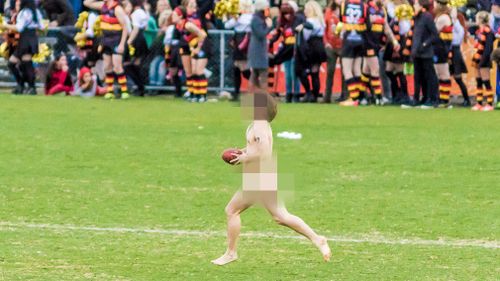 Streakers facing heavy fines after butting in on charity AFL match 