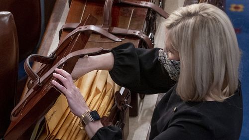 Boxes containing Electoral College votes are opened as a joint session of the House and Senate