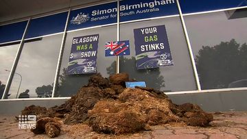The Extinction Rebellion group has left a pile of horse manure outside the office of Federal Finance Minister Simon Birmingham in Adelaide. 