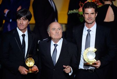 Blatter with coaches of the year Loew, (left) and Ralf Kellermann.