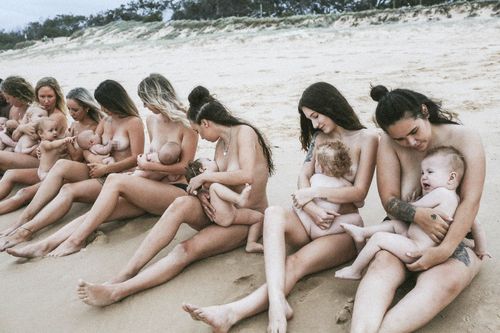 These brave mums celebrated their post pregnancy bodies with a beachside naked breastfeeding session. (Caters)