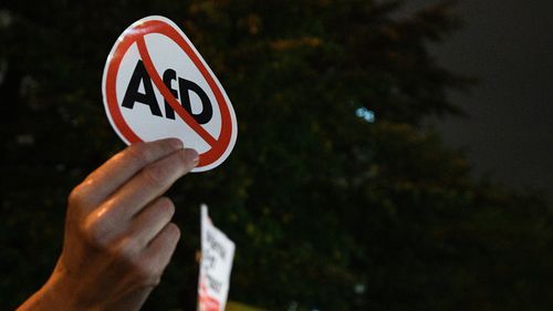 People protested against the Alternative for Germany (AfD) party near a night club where right-wing populist party AfD held their election event in Berlin. (AAP)