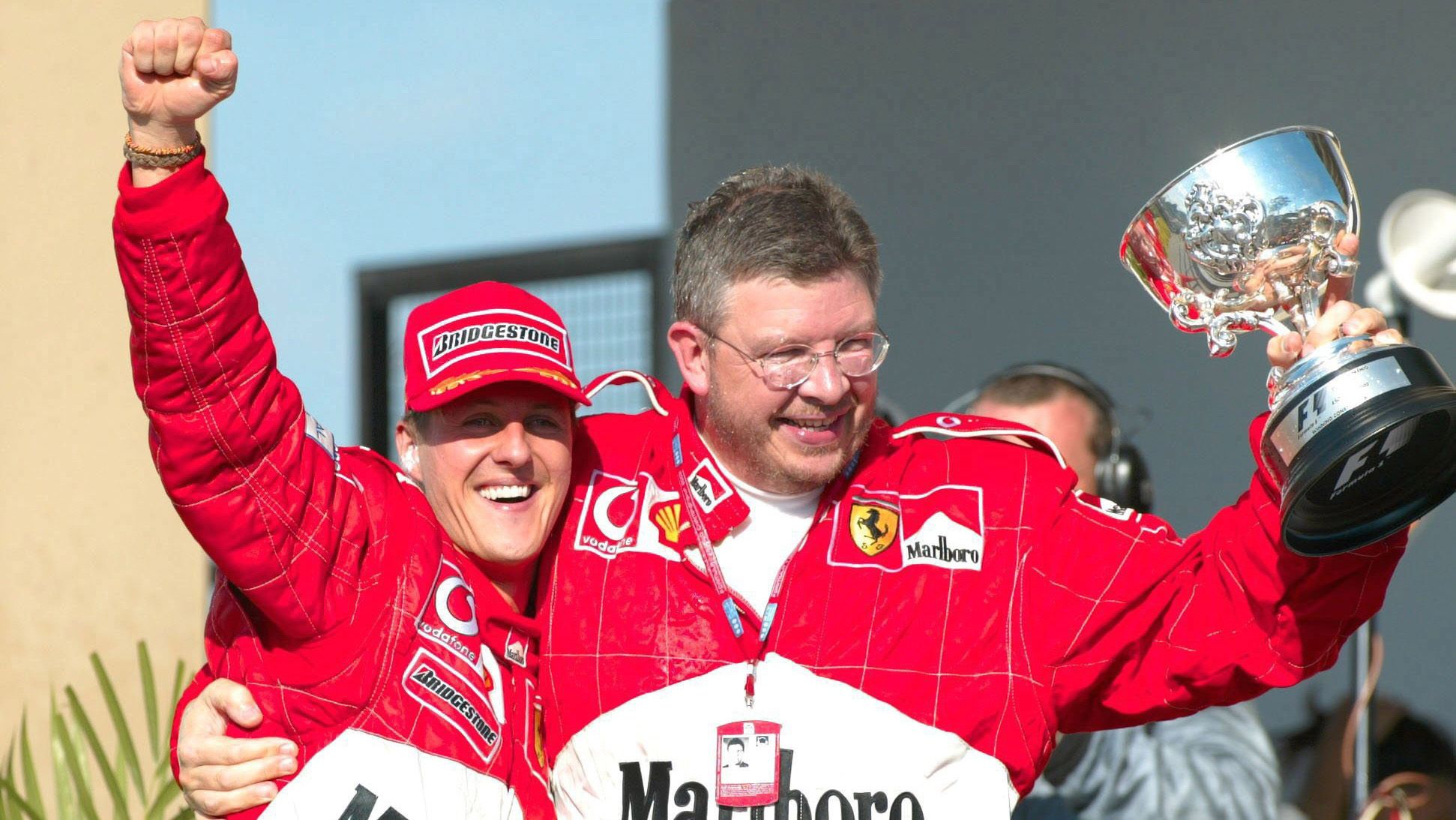 Michael Schumacher and Ross Brawn celebrate winning the 2002 Brazilian Grand Prix in Sao Paulo.