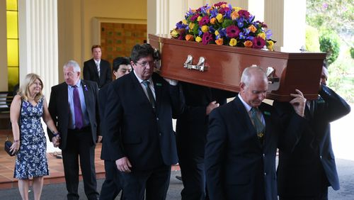 Faye and Mark Leveson watch as their son Matthew's coffin is carried out. (AAP)