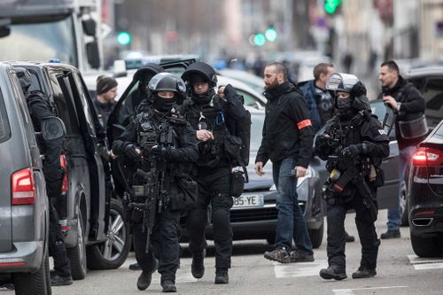 French security forces are trying to catch the suspected Strasbourg gunman dead or alive, as the city in eastern France mourned with flowers and lit candles left at the site of the attack near its famous Christmas market.