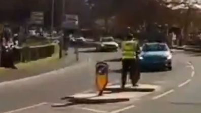 A volunteer was nearly run down by a driver at the Tour De Yorkshire.