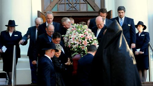  The coffin of murdered Royal North Shore nursing manager Michelle Beets is carried out of Our Lady of Dolours church after her funeral in Chatswood, Sydney. (AAP)