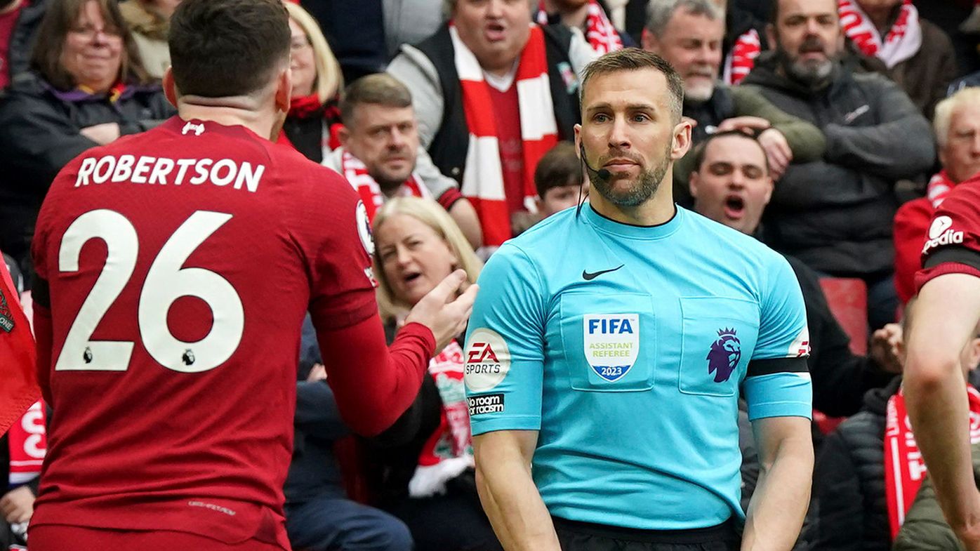 Liverpool&#x27;s Andrew Robertson appeals to assistant referee Constantine Hatzidakis.